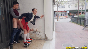 Schoolgirl in a skirt gives a public blowjob