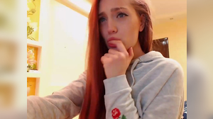 Cute girl keeps her clothes while deepthroating a dildo