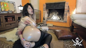 Naughty oiled up chick fucks herself with a dildo