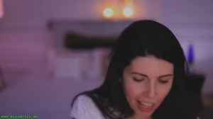 MILF loves massaging her tits over her blouse on camera